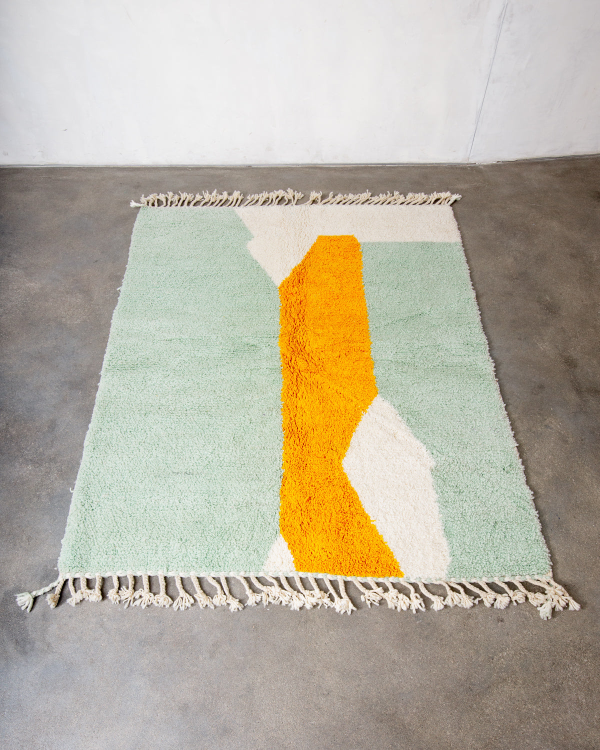 Modern, designer, handcrafted Berber rug from Morocco. Beniourain carpet with beautiful colours and patterns and fluffy wool texture.